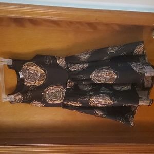 Black and rose gold girls dress with rose gold embleshments. Size 10 never worn